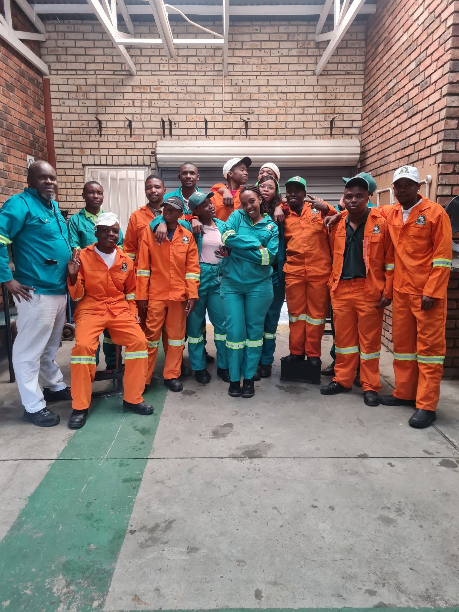 AIET students together in practical workshop clothing